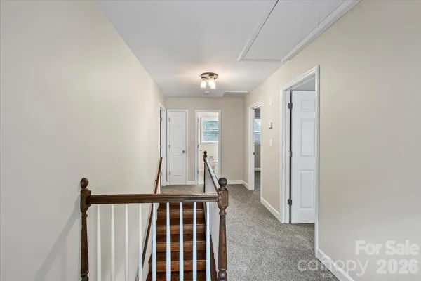 a view of a hallway with closet and entryway