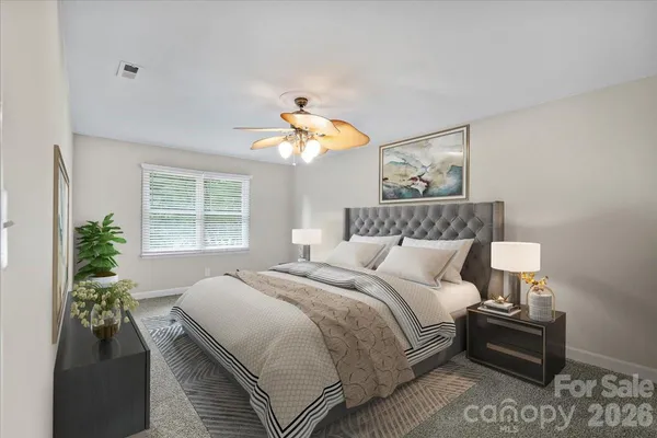a bedroom with bed and window