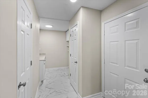 a bathroom with a shower and a glass door