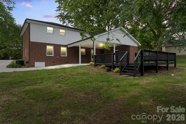 a front view of a house with a yard and pathway
