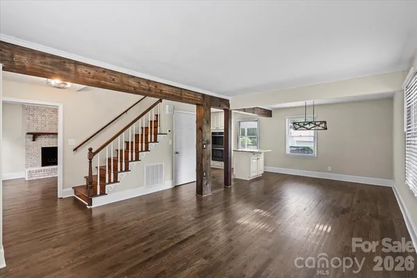 a view of an entryway with wooden floor