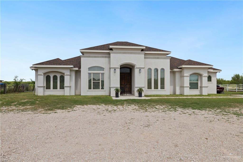 22303 Uresti Road Edinburg, TX 78542 - Photo 2 of 22 Mediterranean / spanish house with stucco siding and roof with shingles