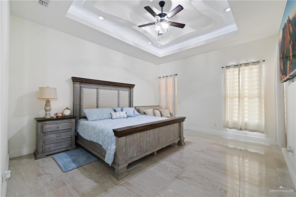 22303 Uresti Road Edinburg, TX 78542 - Photo 10 of 22 Bedroom with a raised ceiling, recessed lighting, and ceiling fan