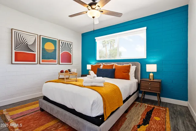 a bedroom with bed and window