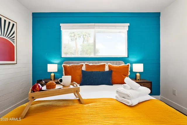 a bedroom with a bed and window