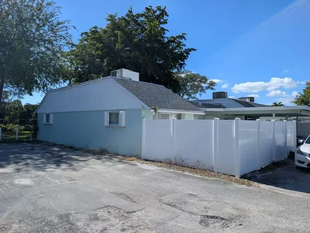 a house with trees in the background