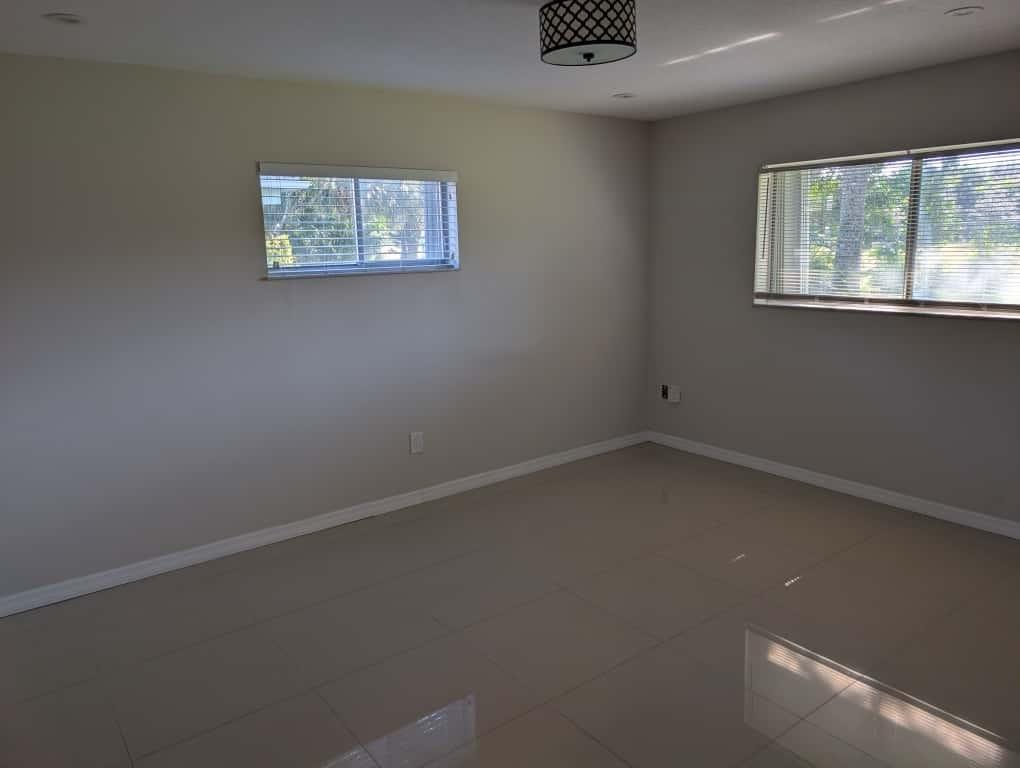 9322 Southwest 5th Street Boca Raton, FL 33428 - Photo 3 of 12 an empty room with a window