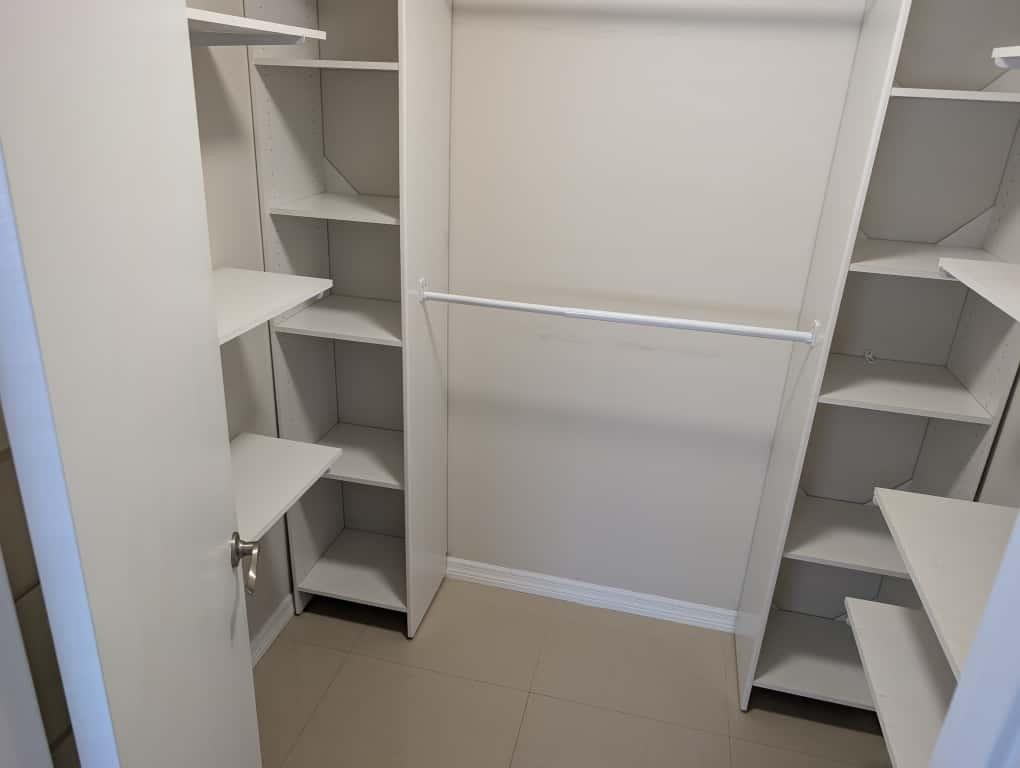 9322 Southwest 5th Street Boca Raton, FL 33428 - Photo 4 of 12 a view of walk in closet with empty racks