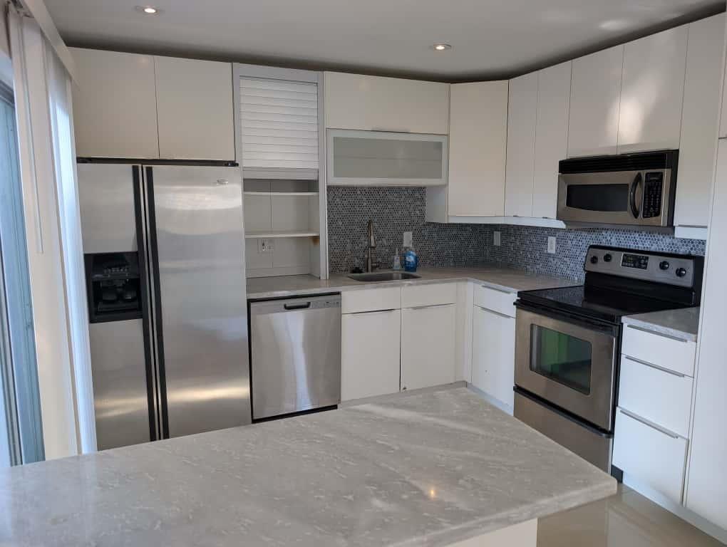 9322 Southwest 5th Street Boca Raton, FL 33428 - Photo 6 of 12 a kitchen with a refrigerator stove and microwave