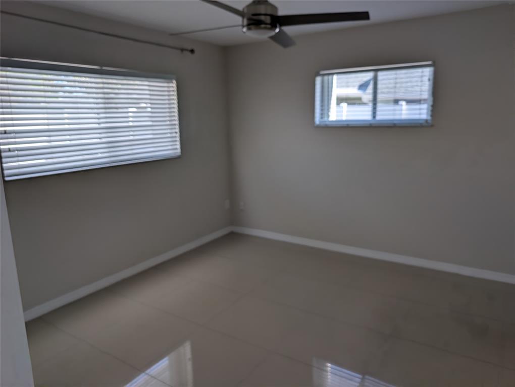 9322 Southwest 5th Street Boca Raton, FL 33428 - Photo 8 of 12 an empty room with a window