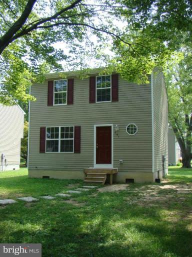 241 Perrys Corner Road Grasonville, MD 21638 - Photo 1 of 7 a view of a house with a yard
