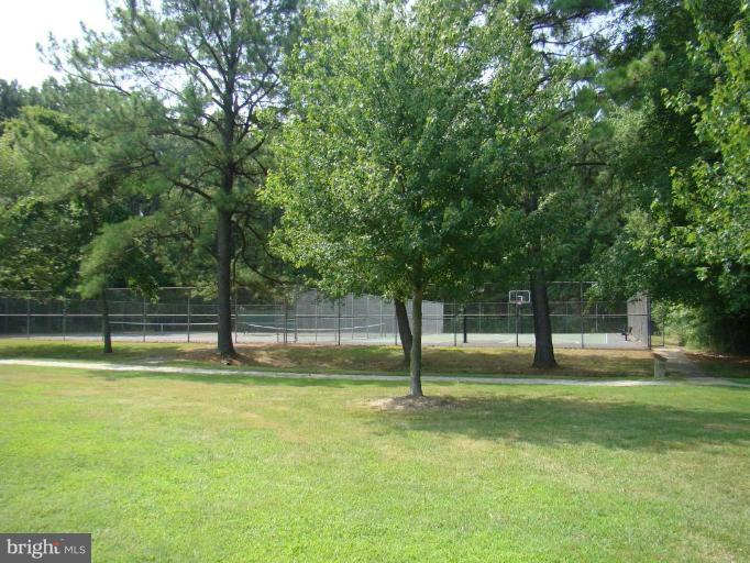 241 Perrys Corner Road Grasonville, MD 21638 - Photo 7 of 7 a view of a backyard with green space
