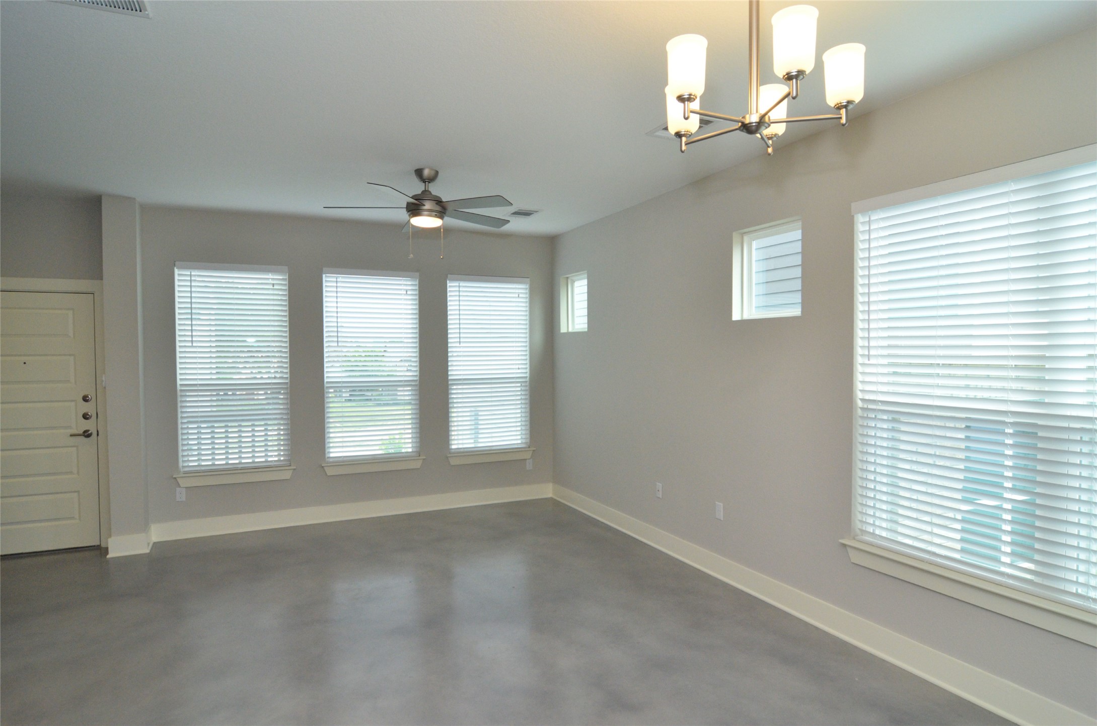 1916 Cleese Drive Austin, TX 78741 - Photo 4 of 36 An airy living space features polished concrete flooring and ample natural light from multiple windows.