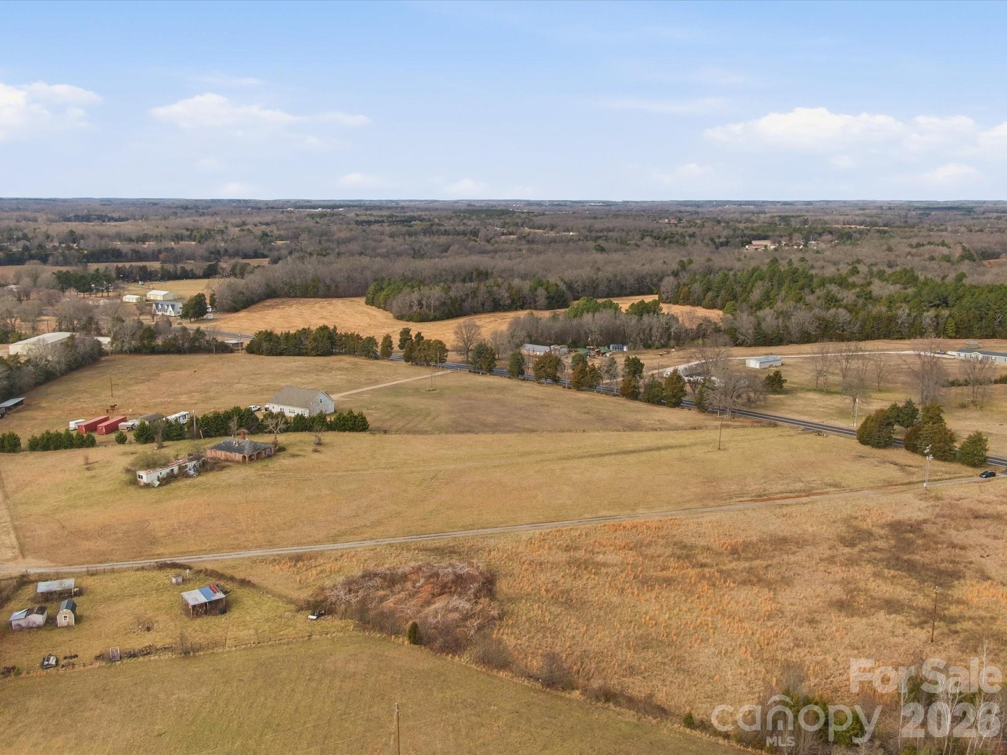 an aerial view of residential building and ocean