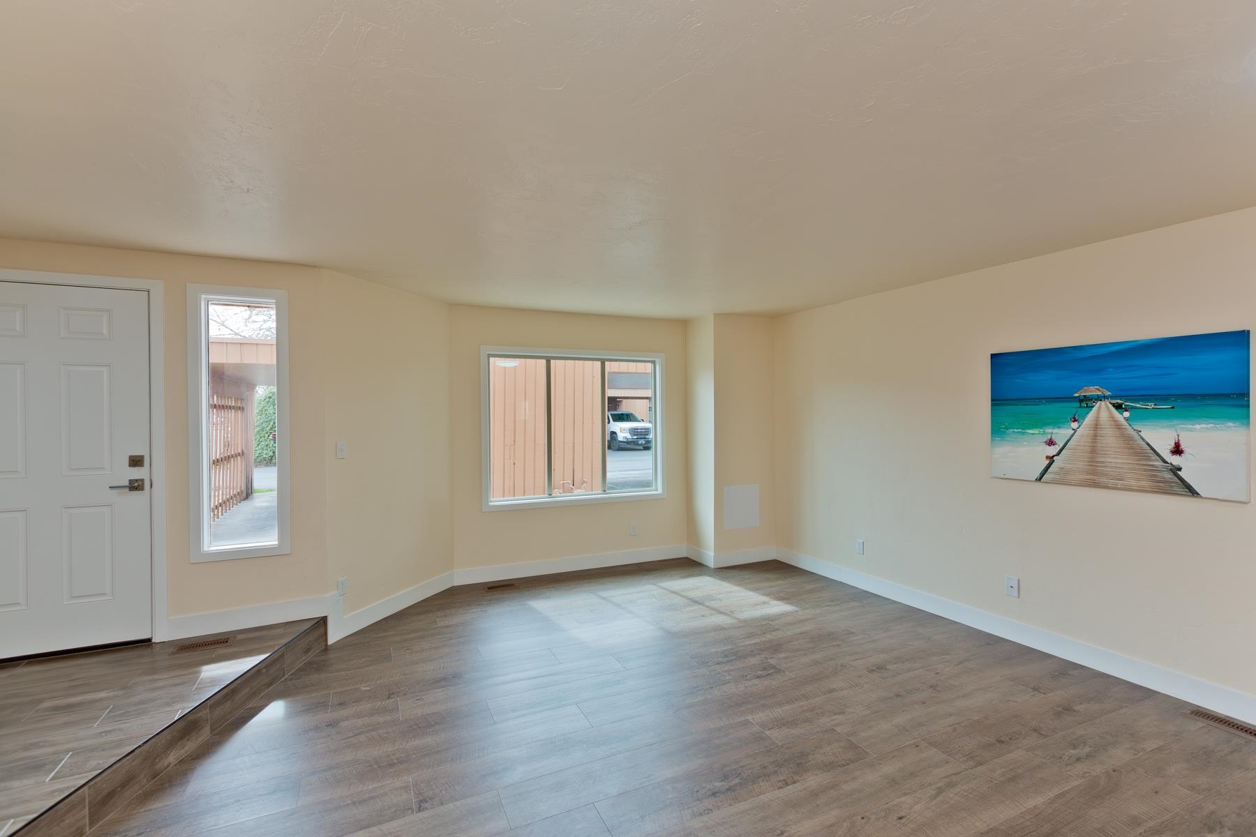 575-28 28 1/2 Road, Unit 44 Grand Junction, CO 81501 - Photo 3 of 39 an empty room with wooden floor and windows