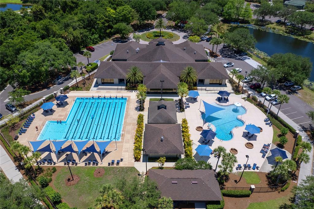 7431 Greystone Street Lakewood Ranch, FL 34202 - Photo 82 of 85 an aerial view of a house with a garden and swimming pool