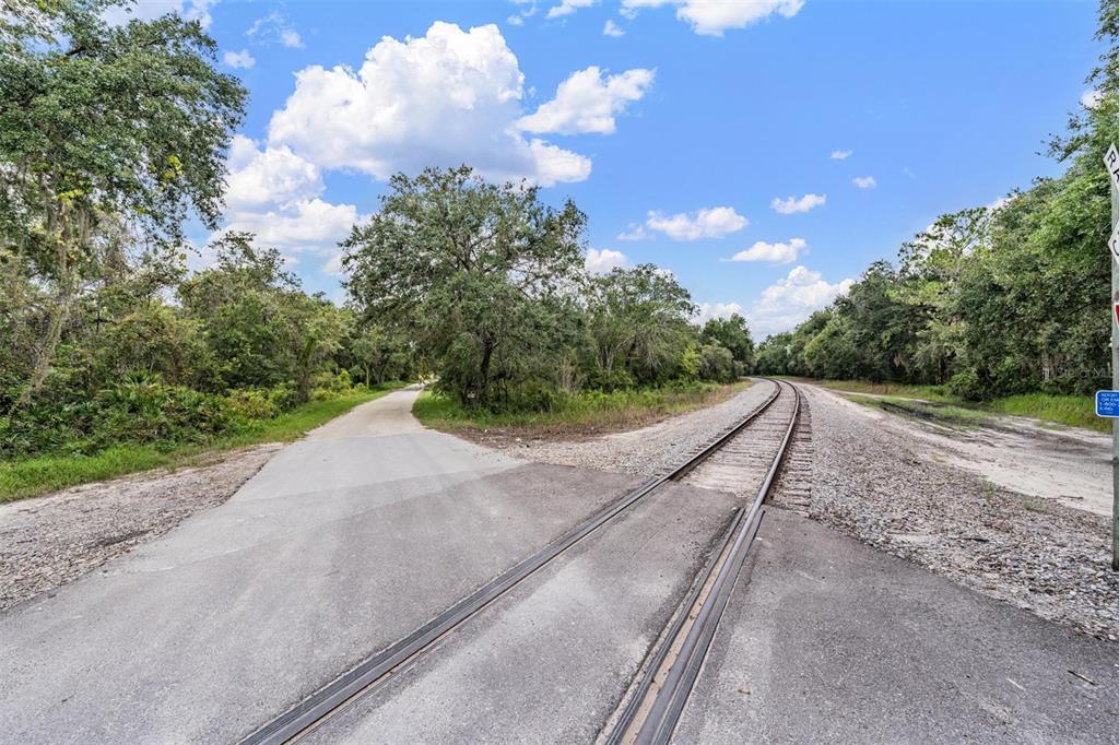 0 Giddens Road Spring Hill, FL 34610 - Photo 14 of 16 a view of a road with a yard