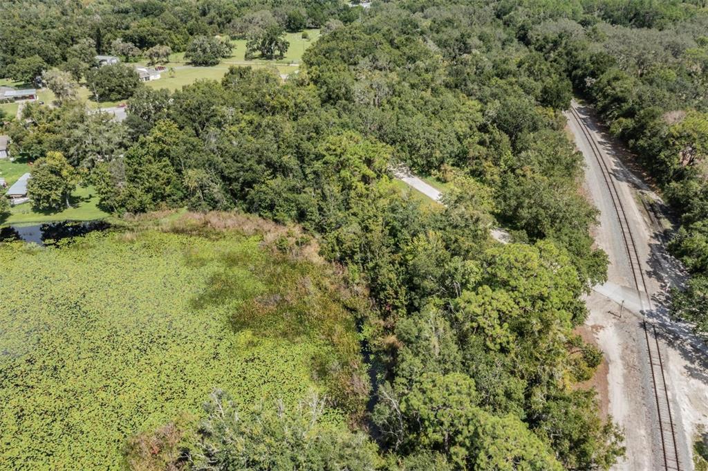 0 Giddens Road Spring Hill, FL 34610 - Photo 9 of 16 an aerial view of residential houses with outdoor space and trees