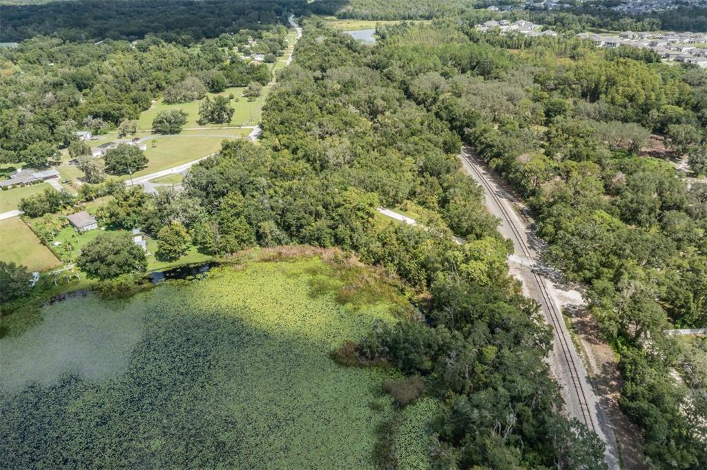 0 Giddens Road Spring Hill, FL 34610 - Photo 10 of 16 an aerial view of residential houses with outdoor space and trees