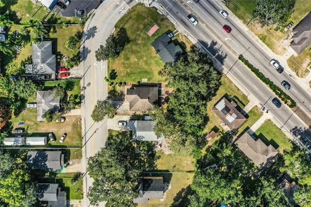 an aerial view of a residential apartment building with a yard