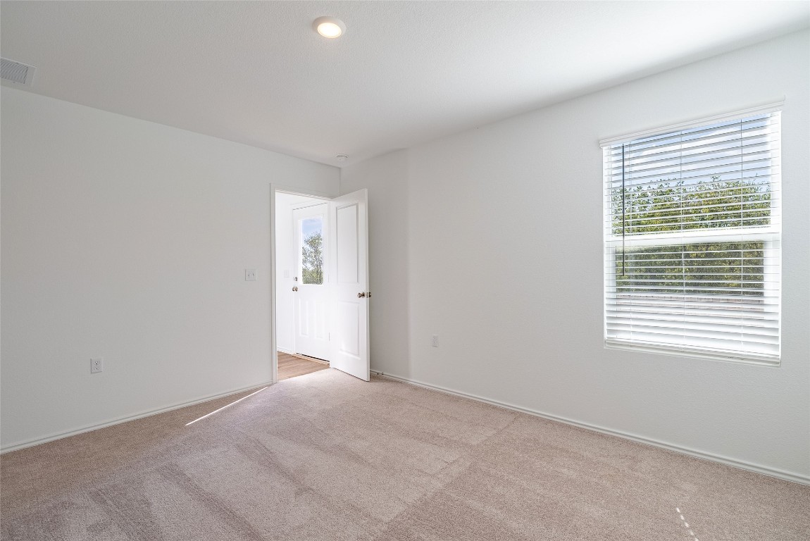 2509 Willkomen Way Pflugerville, TX 78660 - Photo 16 of 20 Spare room featuring carpet and recessed lighting