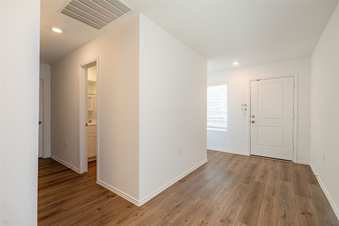 2509 Willkomen Way Pflugerville, TX 78660 - Photo 6 of 20 Foyer with recessed lighting and light wood-style floors