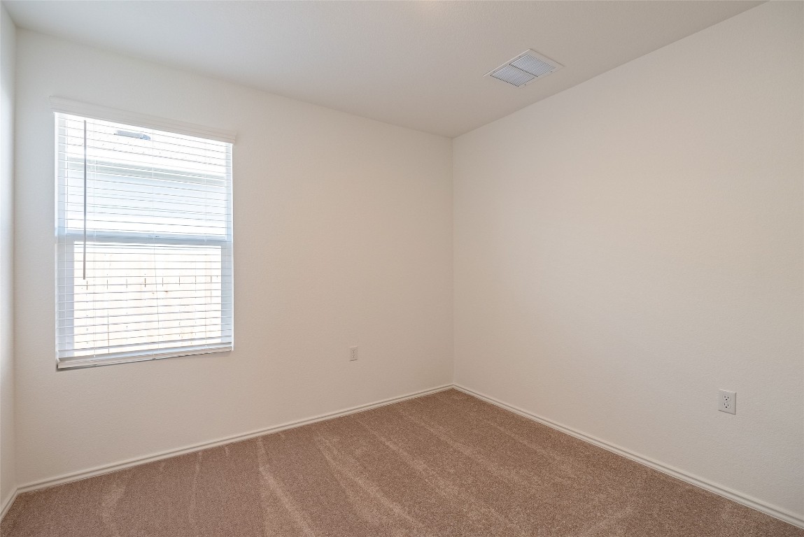 2509 Willkomen Way Pflugerville, TX 78660 - Photo 7 of 20 Spare room with carpet flooring and baseboards