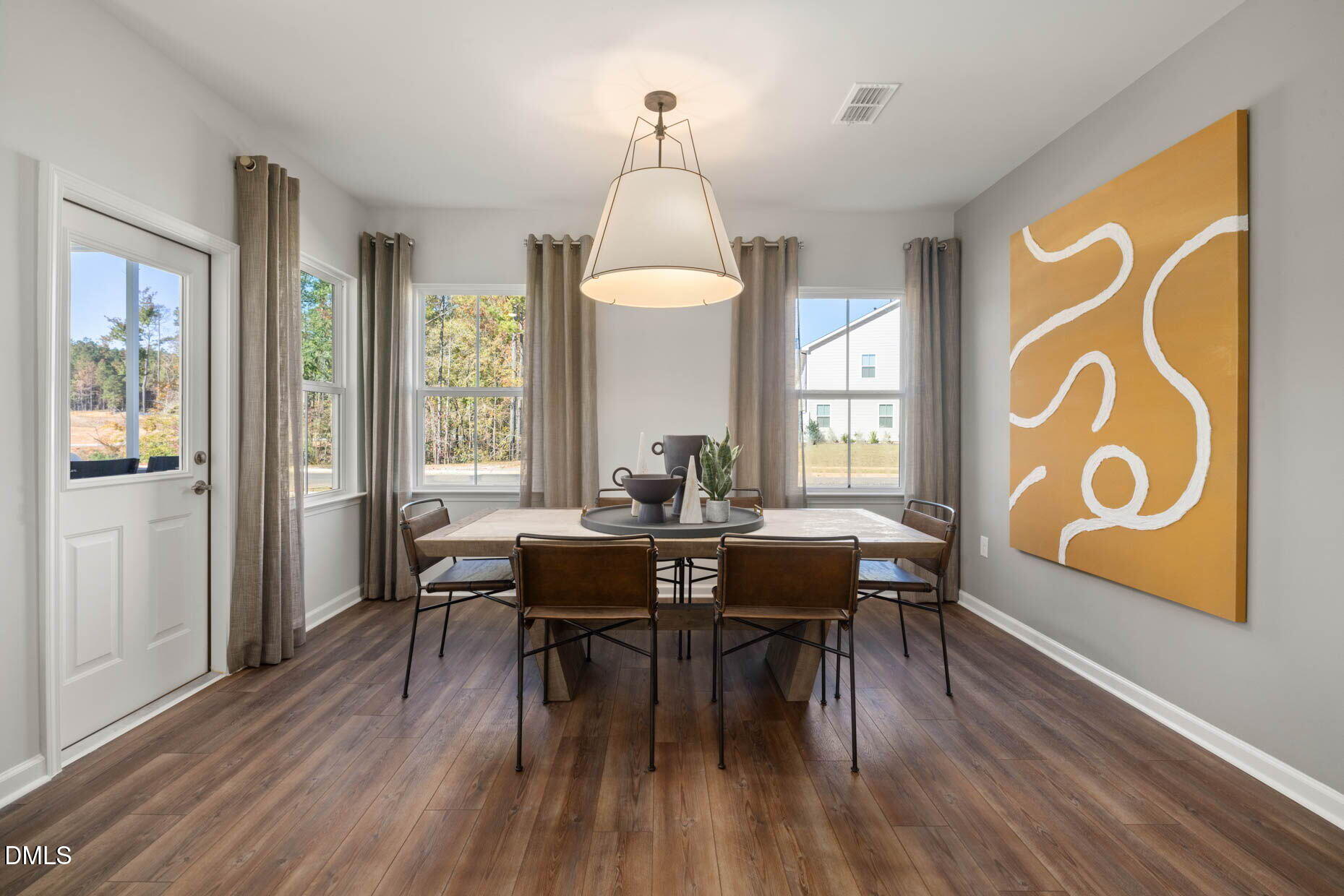 364 Broomside Avenue Raleigh, NC 27603 - Photo 11 of 35 a view of a dining room with furniture window and wooden floor