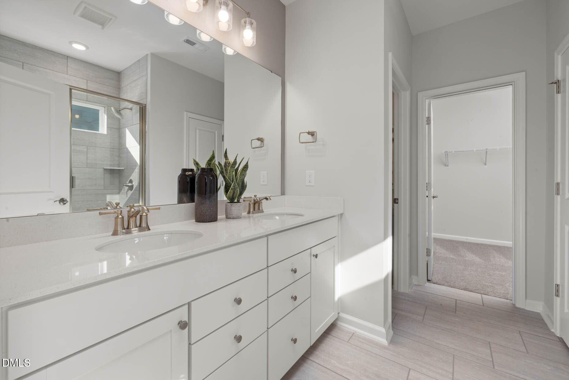 364 Broomside Avenue Raleigh, NC 27603 - Photo 16 of 35 a bathroom with a double vanity sink mirror and shower