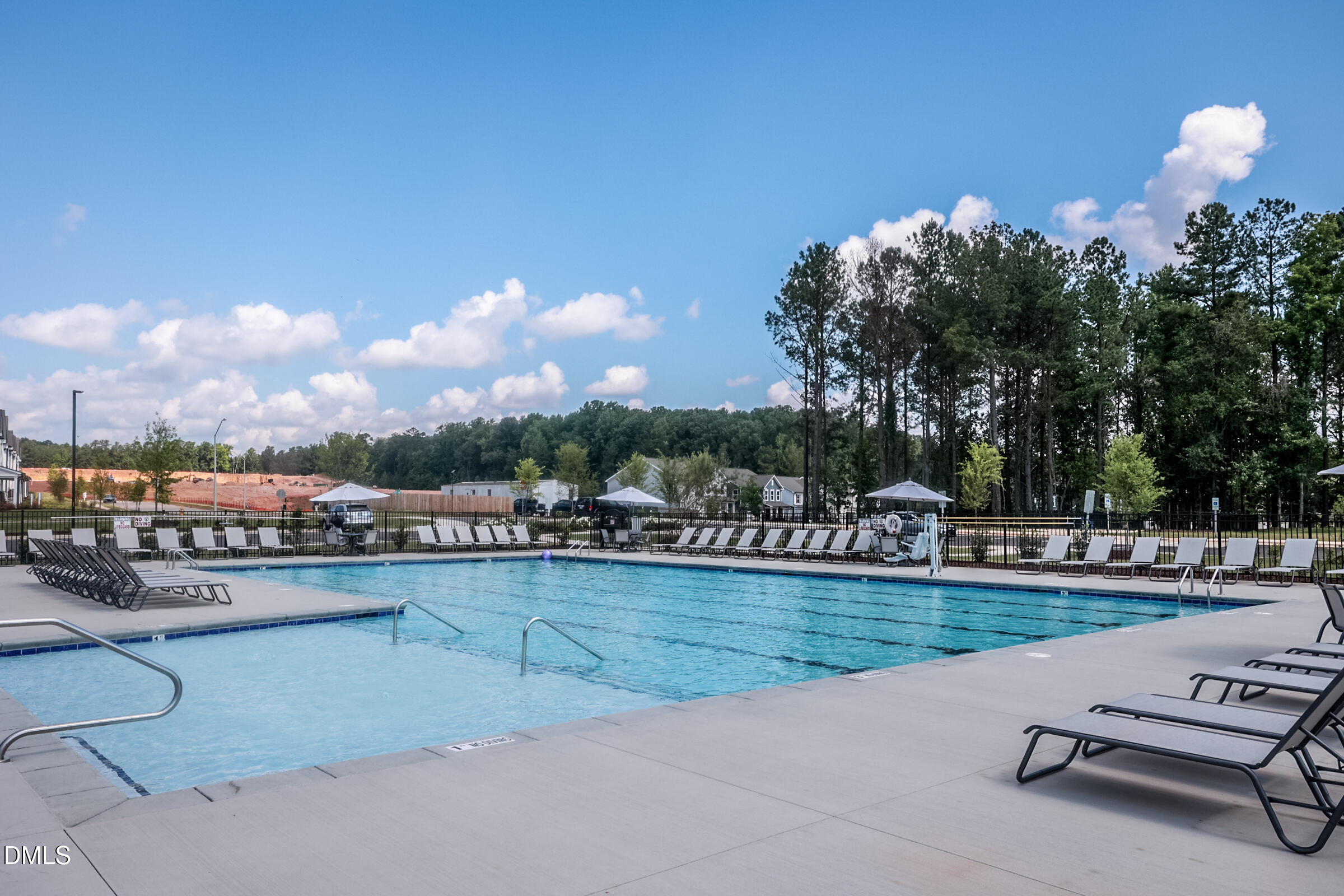 364 Broomside Avenue Raleigh, NC 27603 - Photo 27 of 35 a view of a swimming pool and lounge chairs