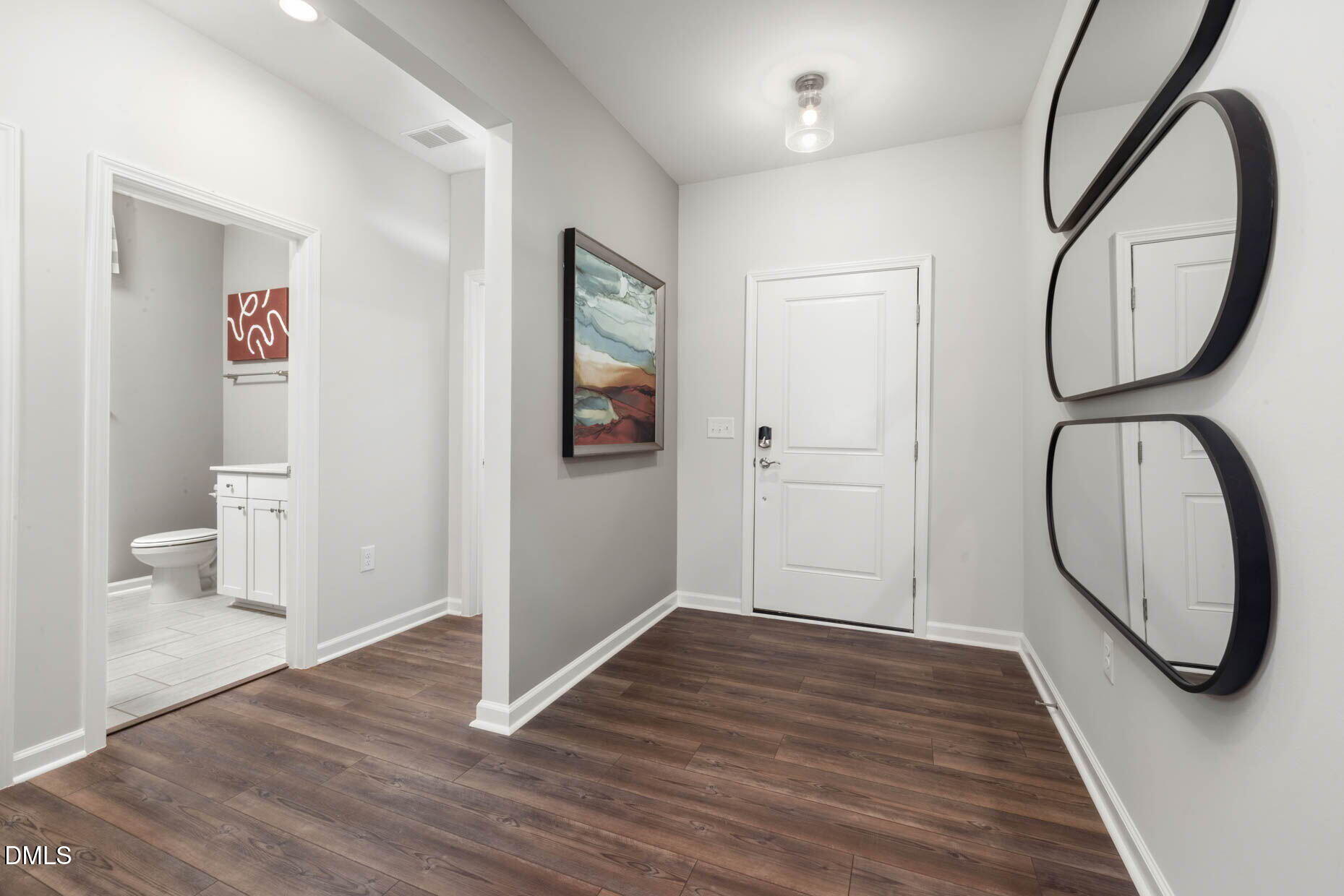 364 Broomside Avenue Raleigh, NC 27603 - Photo 3 of 35 a view of a hallway with wooden floor and entryway