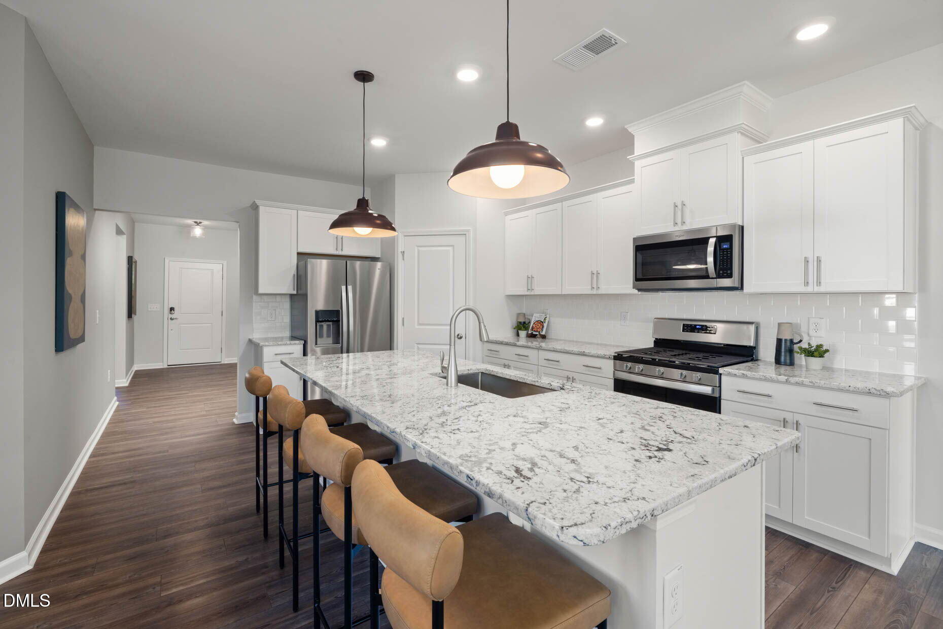 364 Broomside Avenue Raleigh, NC 27603 - Photo 5 of 35 a kitchen with stainless steel appliances granite countertop a stove a sink a microwave a refrigerator and chairs