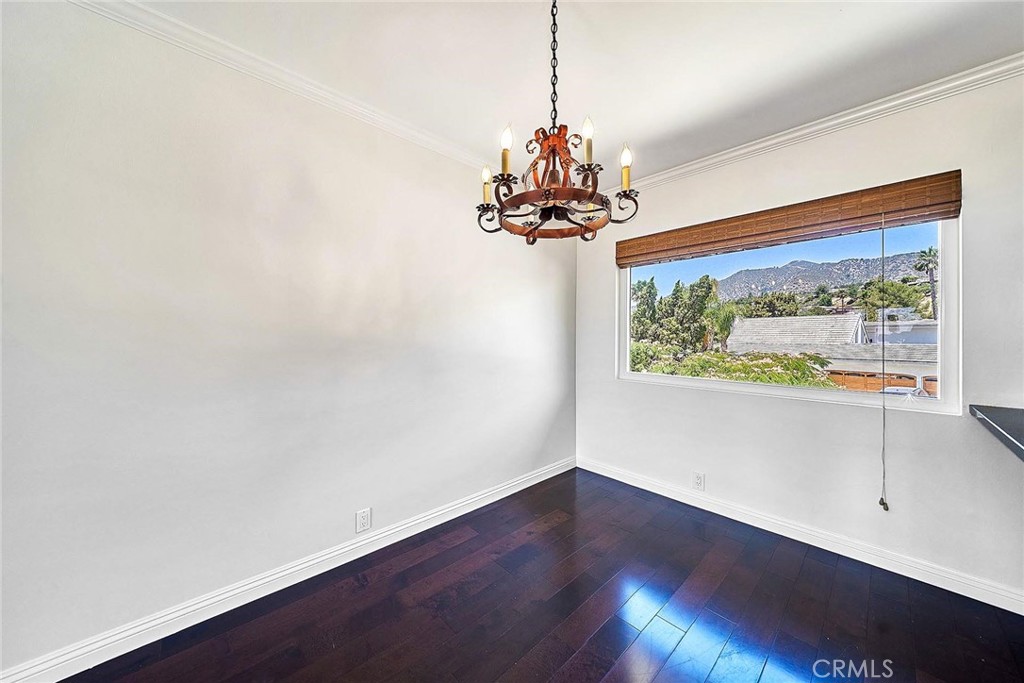 416 Meadowview Drive La Canada Flintridge, CA 91011 - Photo 12 of 35 a view of a room with wooden floor and a chandelier