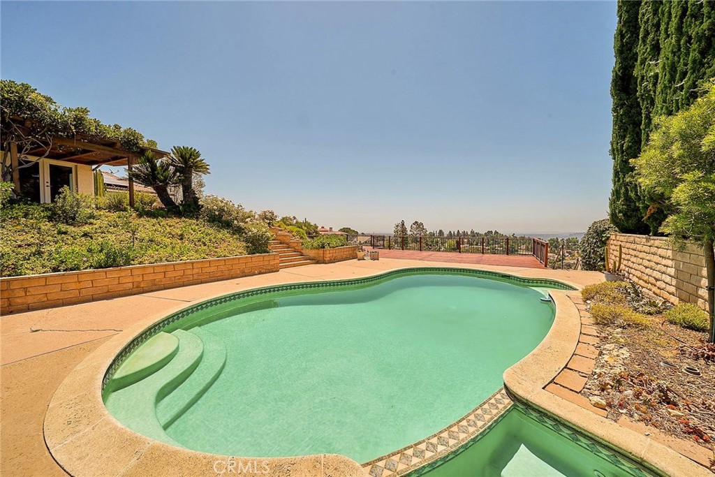 416 Meadowview Drive La Canada Flintridge, CA 91011 - Photo 26 of 35 a view of a swimming pool with a yard