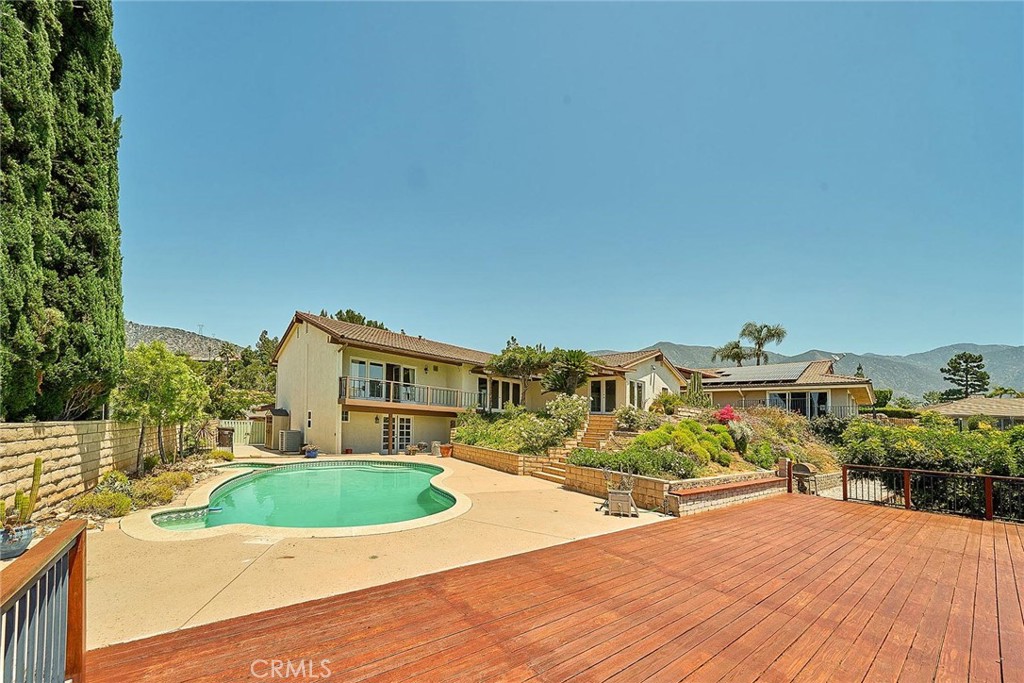 416 Meadowview Drive La Canada Flintridge, CA 91011 - Photo 27 of 35 a view of a house with a yard and potted plants