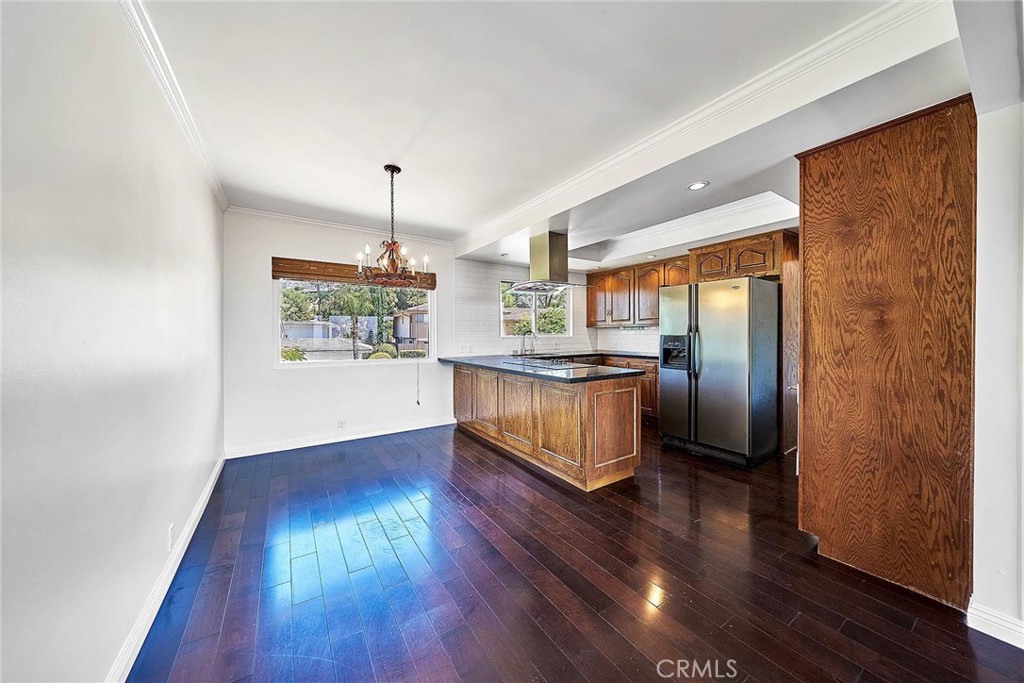 416 Meadowview Drive La Canada Flintridge, CA 91011 - Photo 9 of 35 a kitchen with stainless steel appliances granite countertop a refrigerator a oven a sink with wooden floors and cabinets