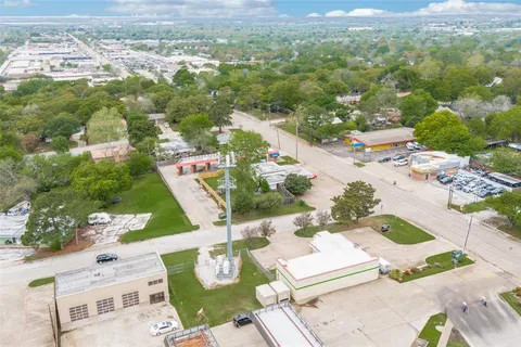 an aerial view of residential house with outdoor space and parking