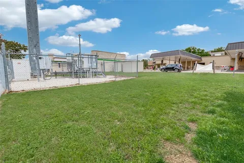 a view of a house with a big yard