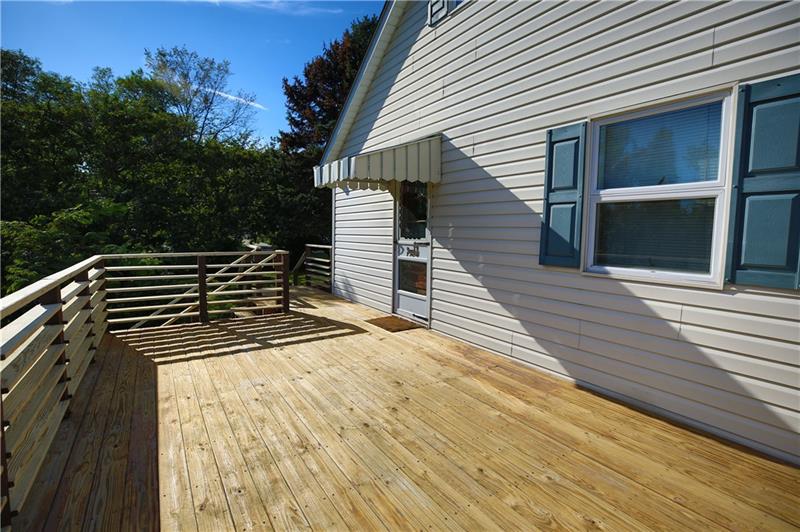 13420 Ridge Road North Huntingdon, PA 15642 - Photo 5 of 17 Access both the side and rear yards easily with two sets of stairs on this ~11 x 19 deck.