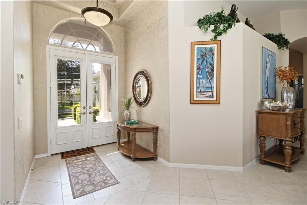1901 Winding Oaks Way Naples, FL 34109 - Photo 6 of 21 a view of entryway with livingroom and furniture