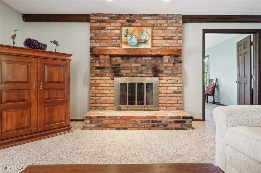 16737 Claridon Troy Road Burton, OH 44021 - Photo 10 of 46 The masonry brick fireplace is the focal point of this room