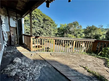 a balcony with wooden floor