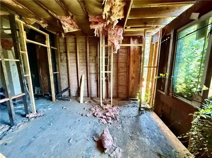 a view of a porch with red door