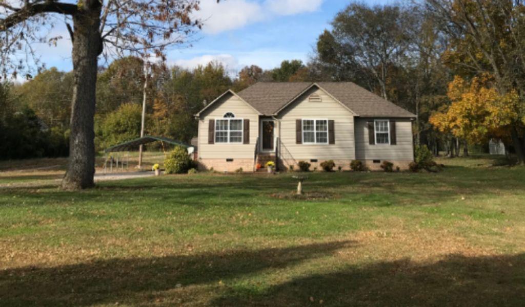 1989 Lasea Road Spring Hill, TN 37174 - Photo 17 of 17 This is the view from the road showing how deep this yard is! Plenty of room to explore for the kids or animals! No HOA means you can have goats & chickens if you'd like!