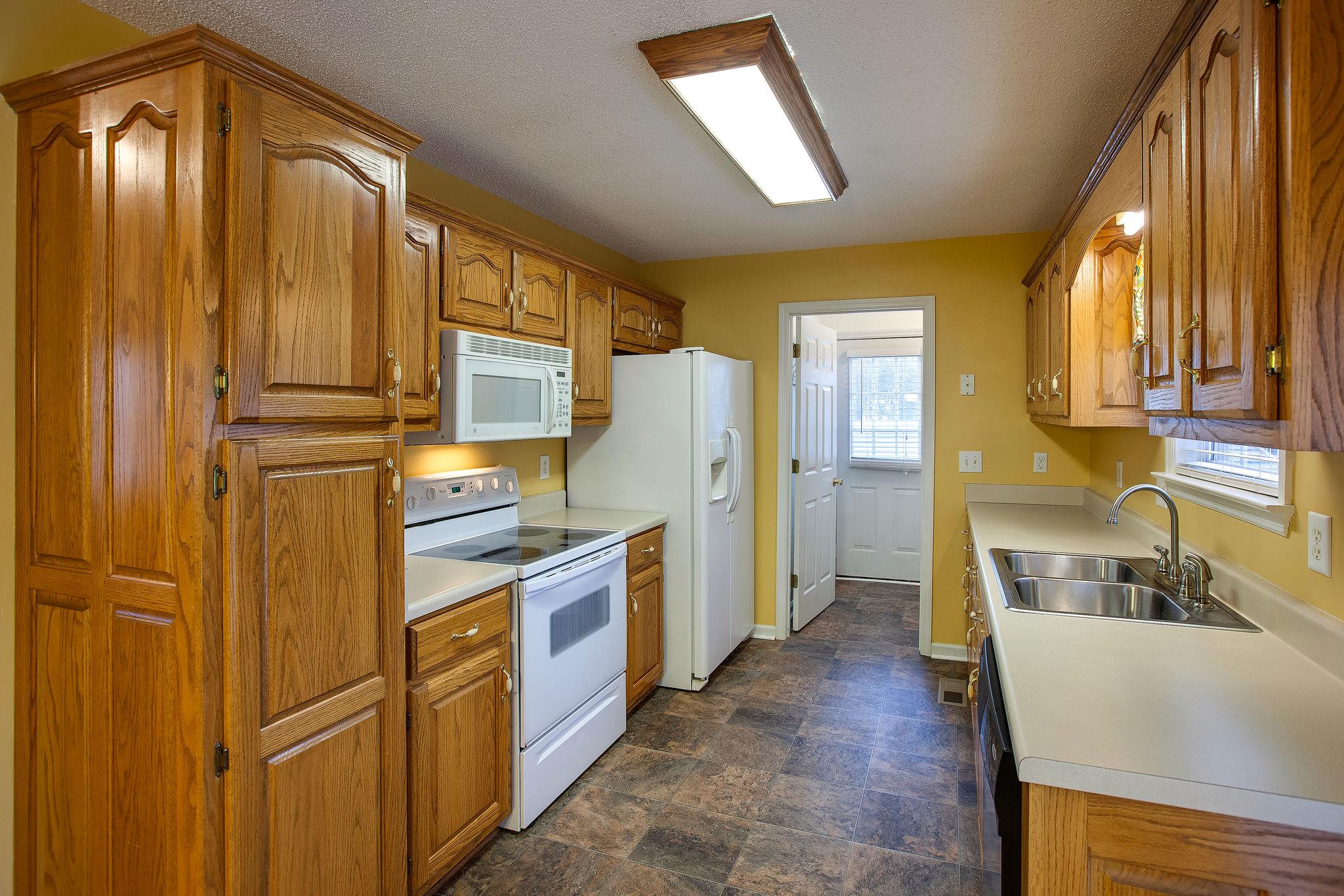 1989 Lasea Road Spring Hill, TN 37174 - Photo 5 of 17 Nice bright Kitchen with lots of extra storage and newer appliances! (Side door and Laundry Room are off the Kitchen.)