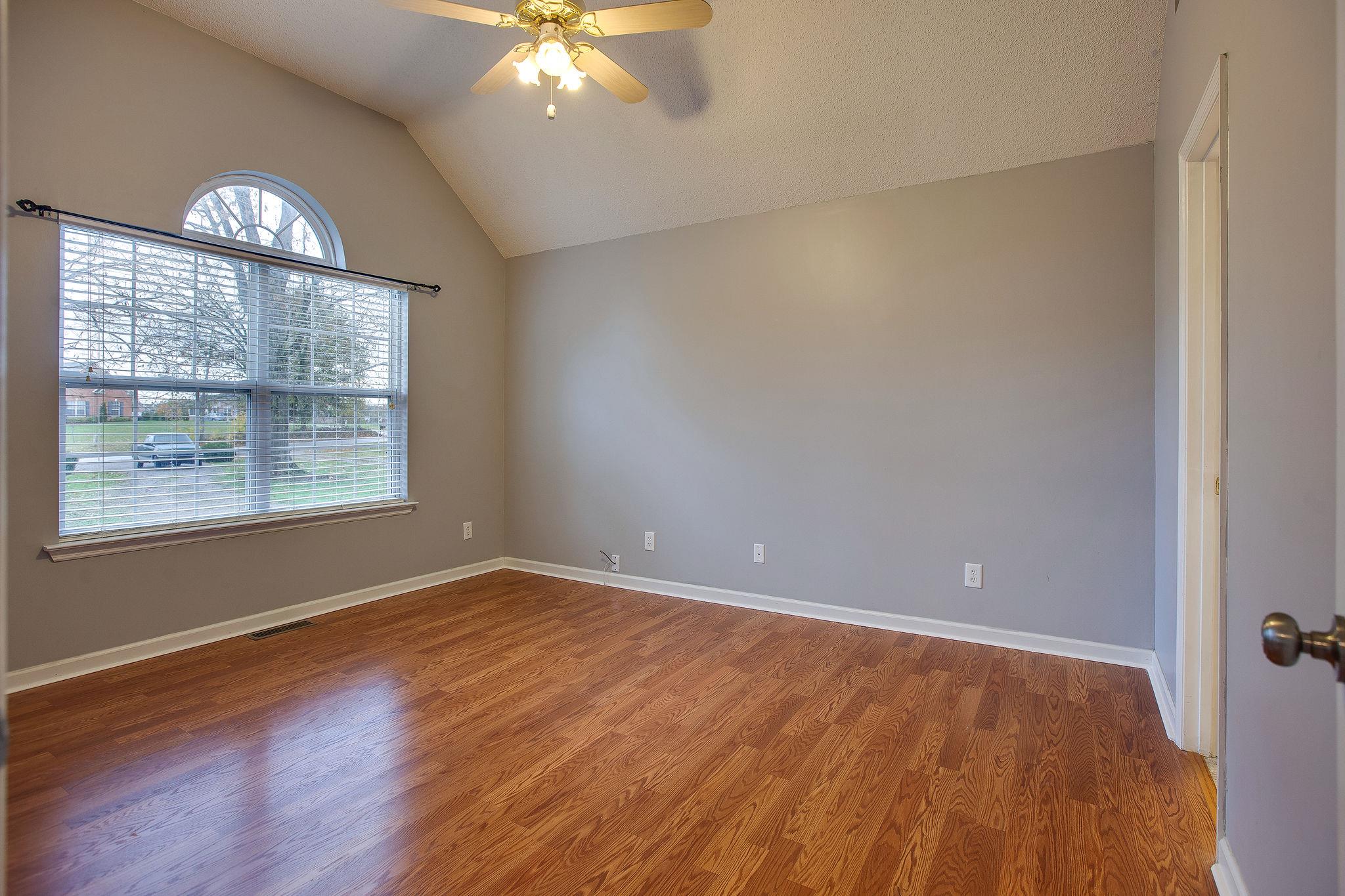 1989 Lasea Road Spring Hill, TN 37174 - Photo 8 of 17 The Master Bedroom has more Vaulted Ceilings and hardwood floors! Beautiful windows too!