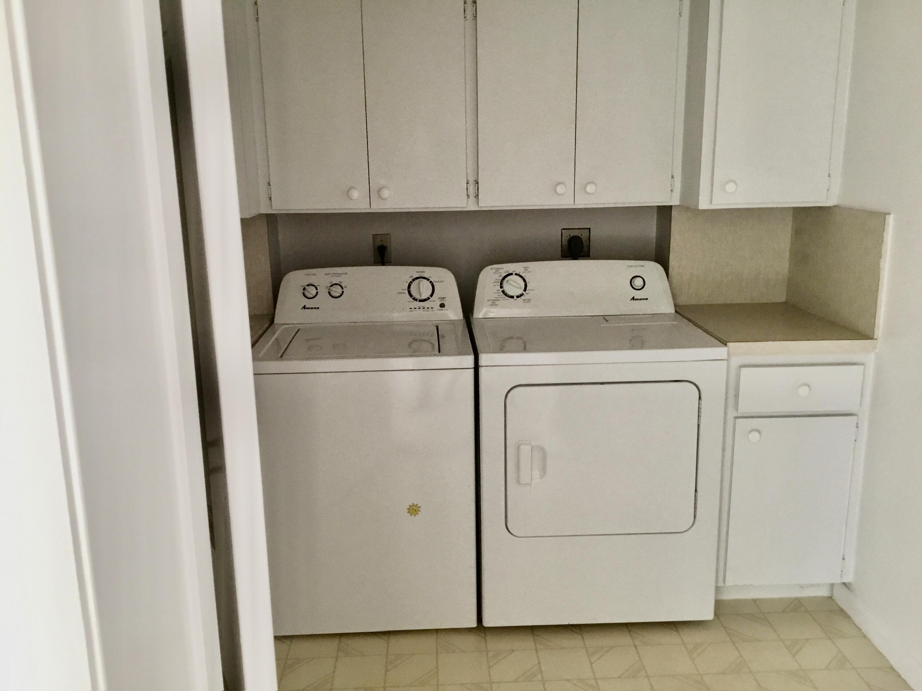 3636 Whitehall Drive, Unit 101 West Palm Beach, FL 33401 - Photo 15 of 16 a utility room with dryer and washer