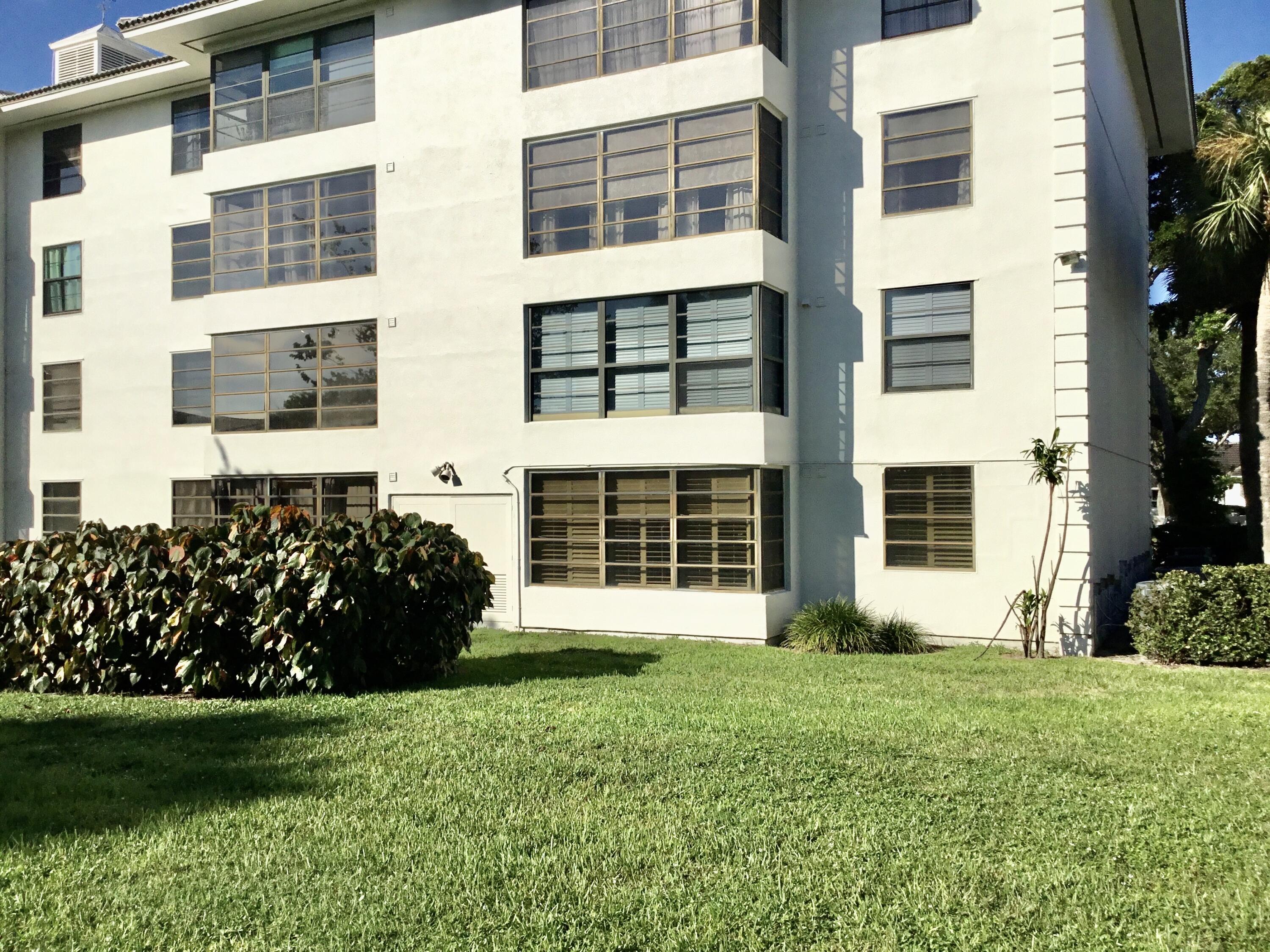 3636 Whitehall Drive, Unit 101 West Palm Beach, FL 33401 - Photo 16 of 16 a view of a house with a garden