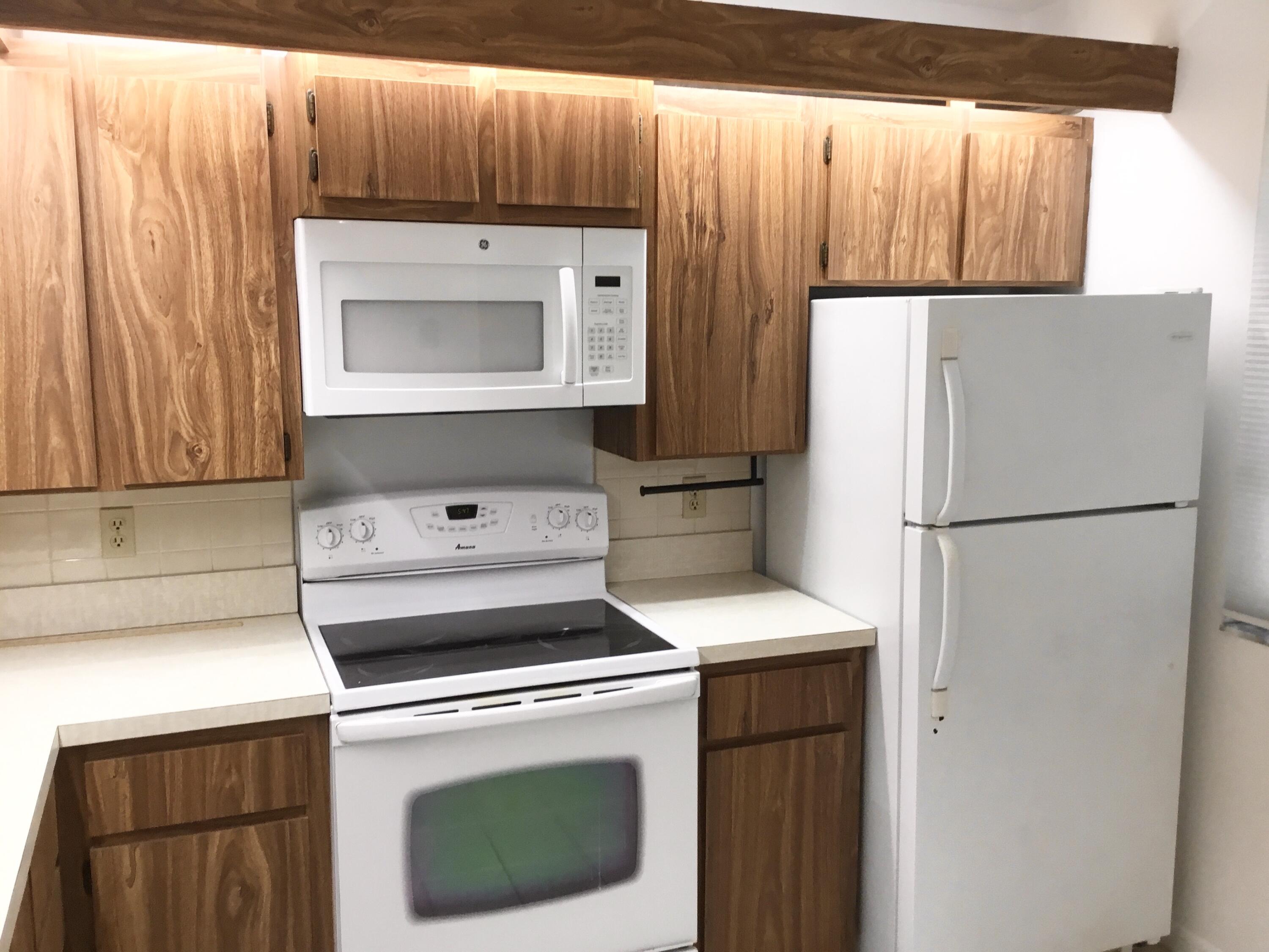 3636 Whitehall Drive, Unit 101 West Palm Beach, FL 33401 - Photo 3 of 16 a utility room with dryer and washer