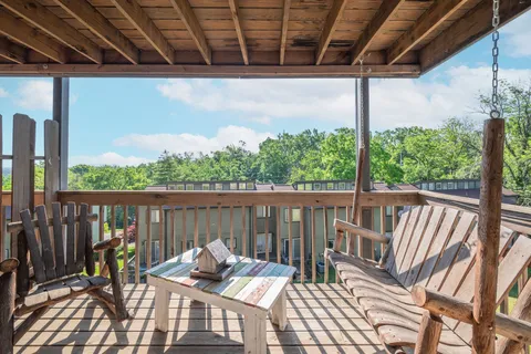 a view of balcony with furniture